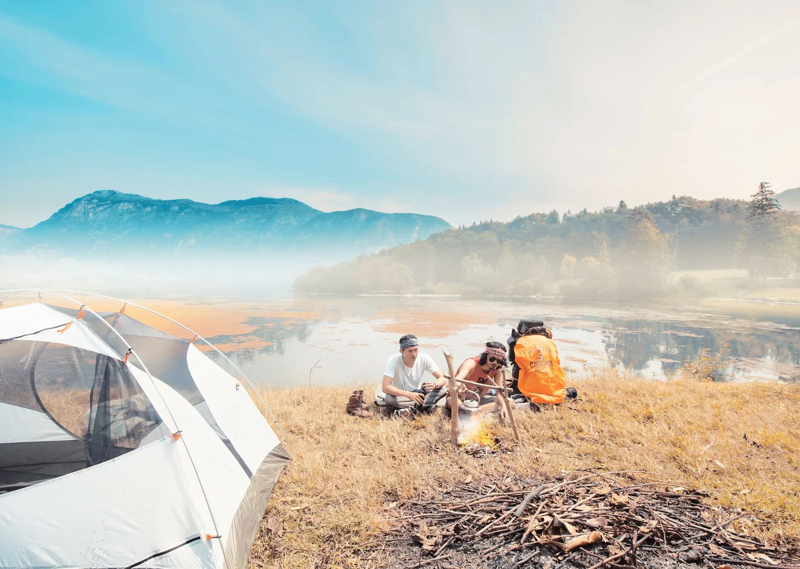 Enjoy a serene camping experience by the lake with friends surrounded by mountains – ultralight gear evaluation