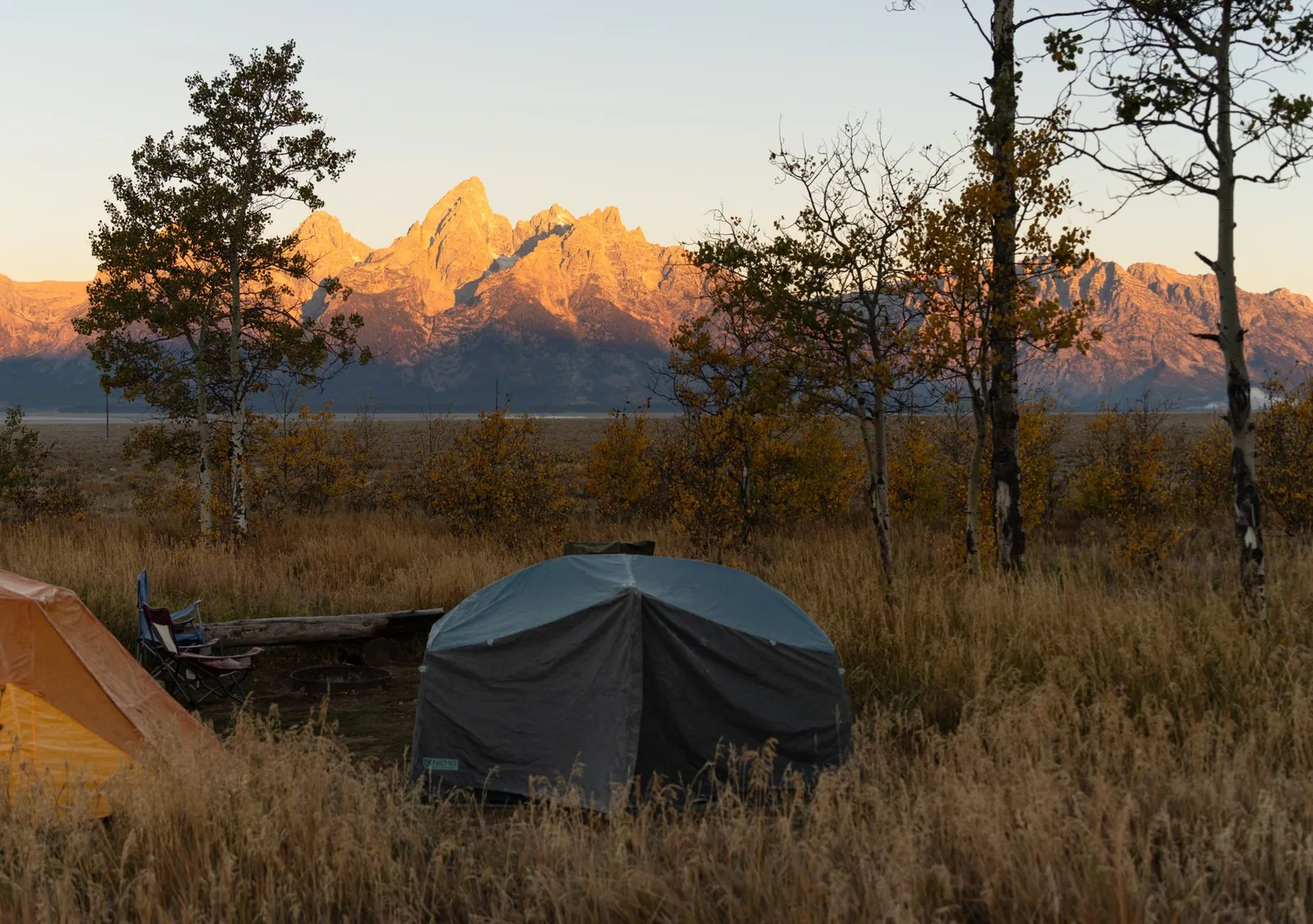 Scenic campsite with tents and fall foliage in Grand Teton National Park – ultralight gear evaluation